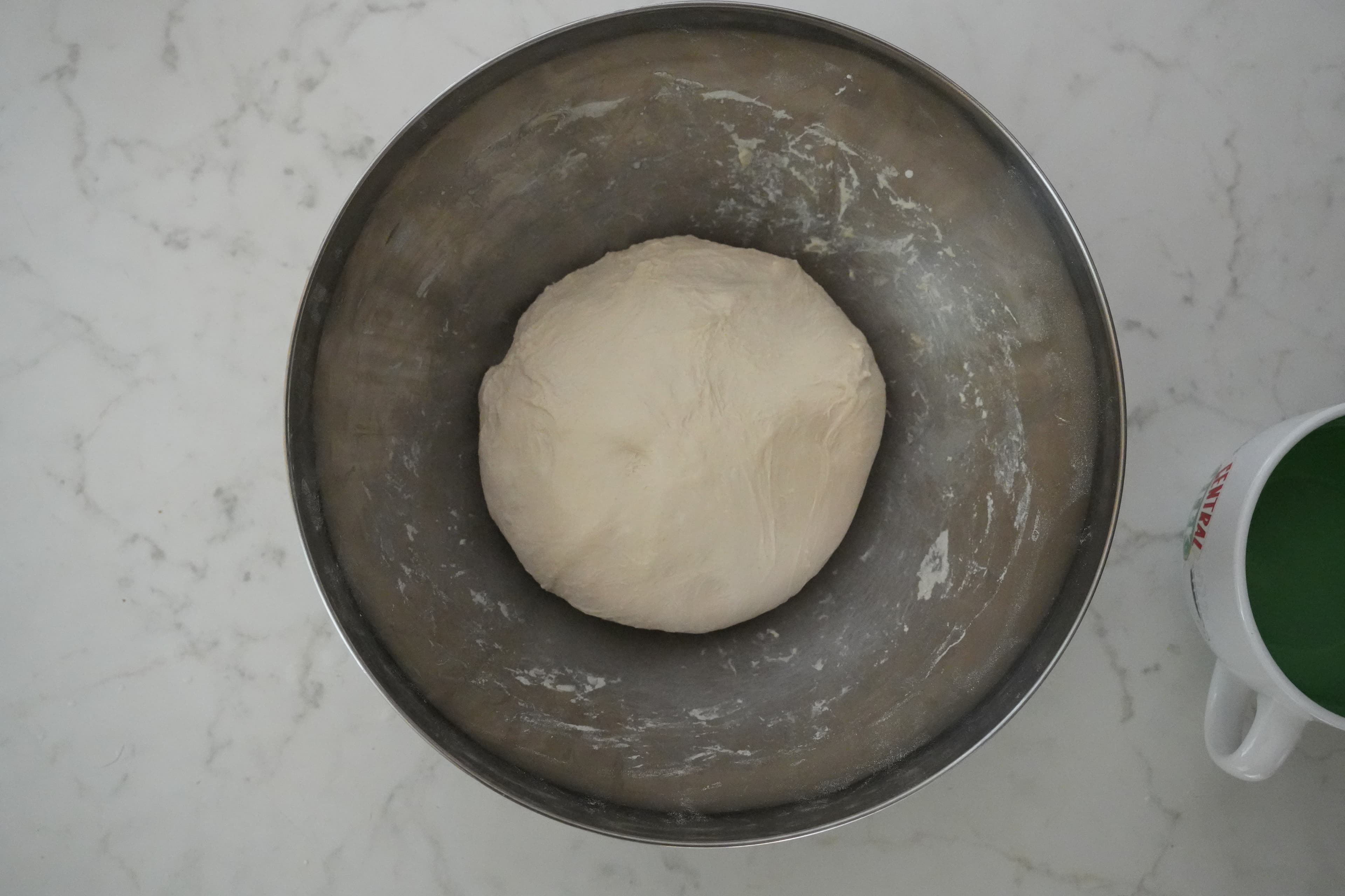 Dough after additional folds, showing a smoother surface.